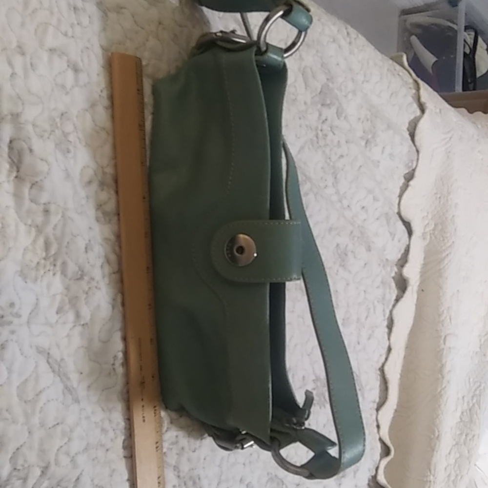 Woman light blue Hype adjustable soulder/hand strap inside zippered pocket used